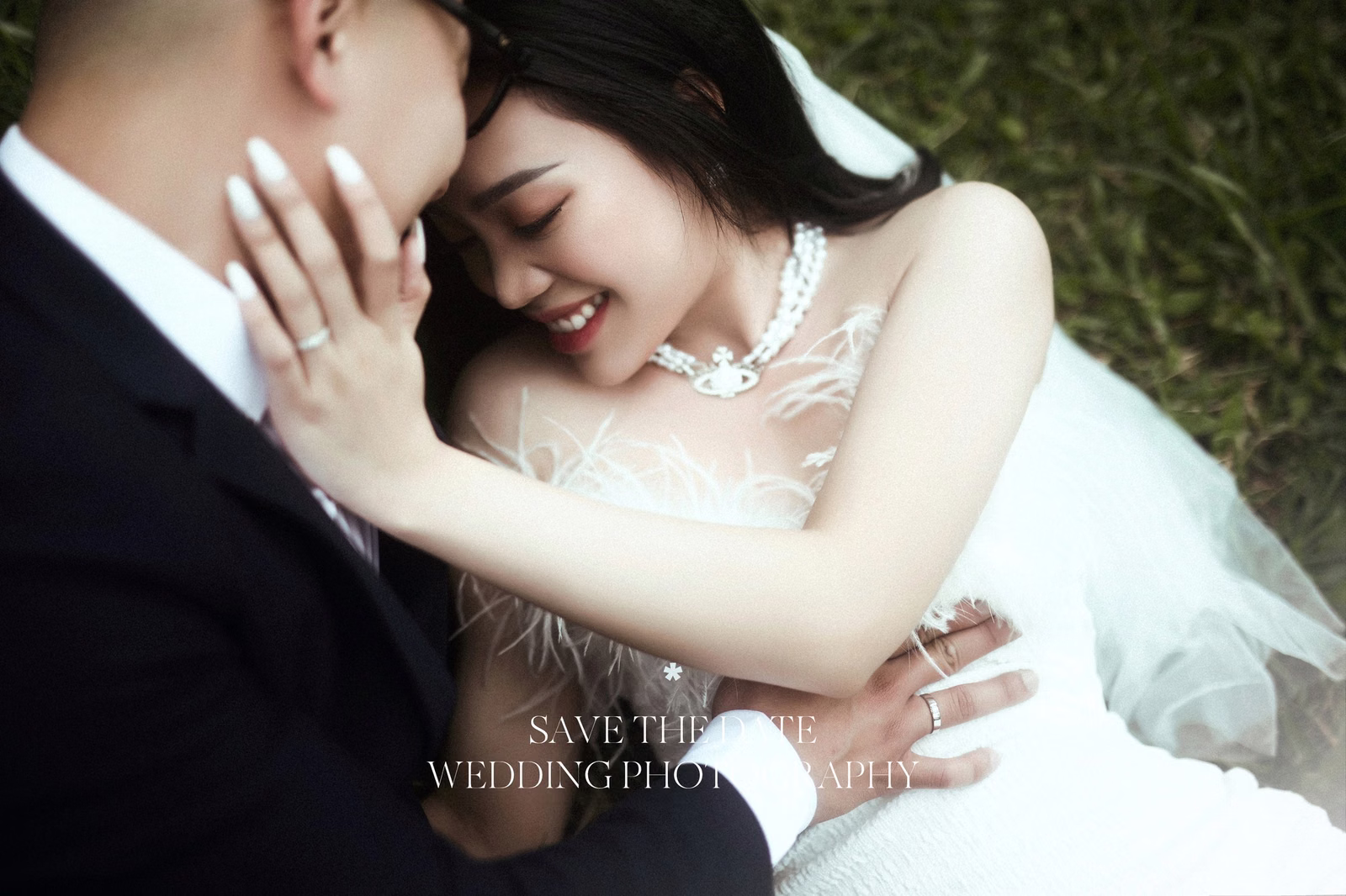 The bride leans against the groom in a wedding photograph with decorative lettering.