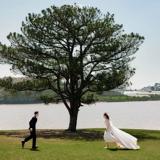 The groom runs toward the bride by the lakeside pine at Cây Thông Cô Đơn, Đà Lạt