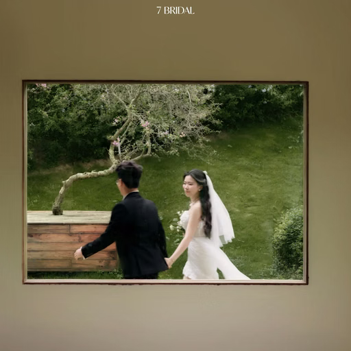 The couple looks at each other through a window opening onto a Đà Lạt café garden.