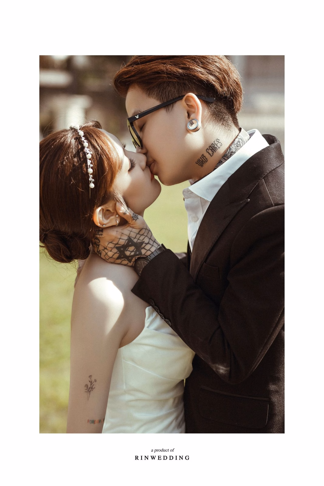 The groom kisses the bride's forehead at Nhà thờ Don Bosco