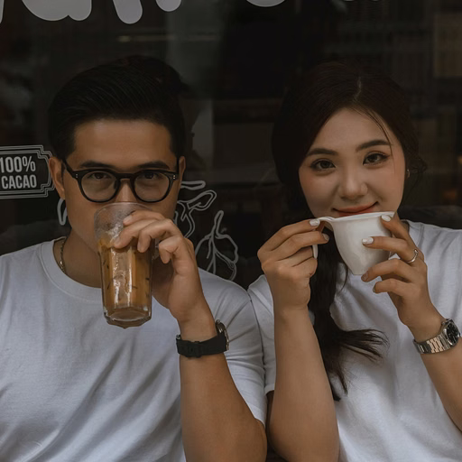 The couple enjoying drinks outside a Da Lat café.
