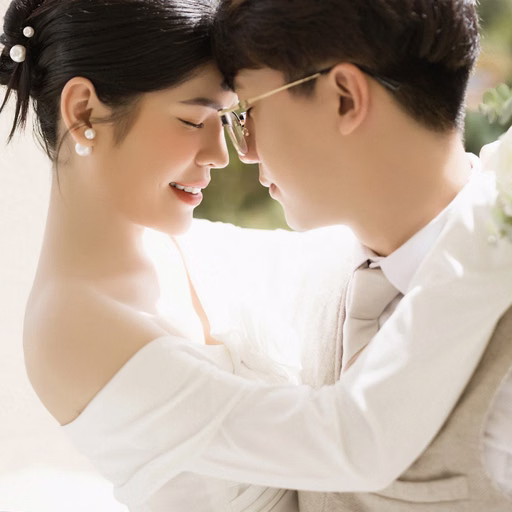 Close-up of the bride and groom touching foreheads at Nhà thờ Don Bosco