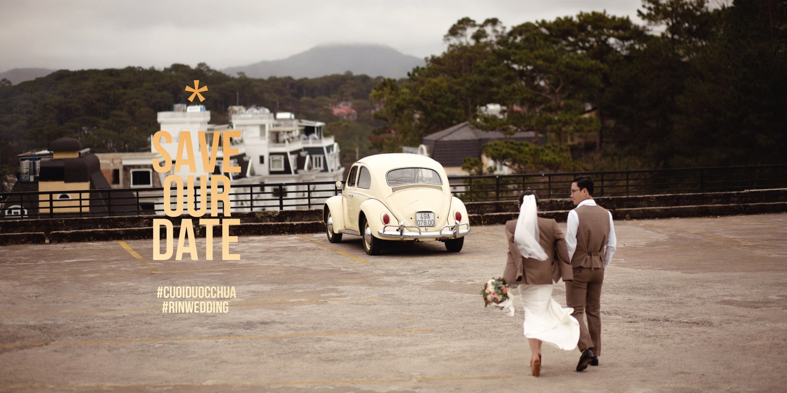 The couple walks toward a cream vintage car in the Cáp Treo Đà Lạt area.