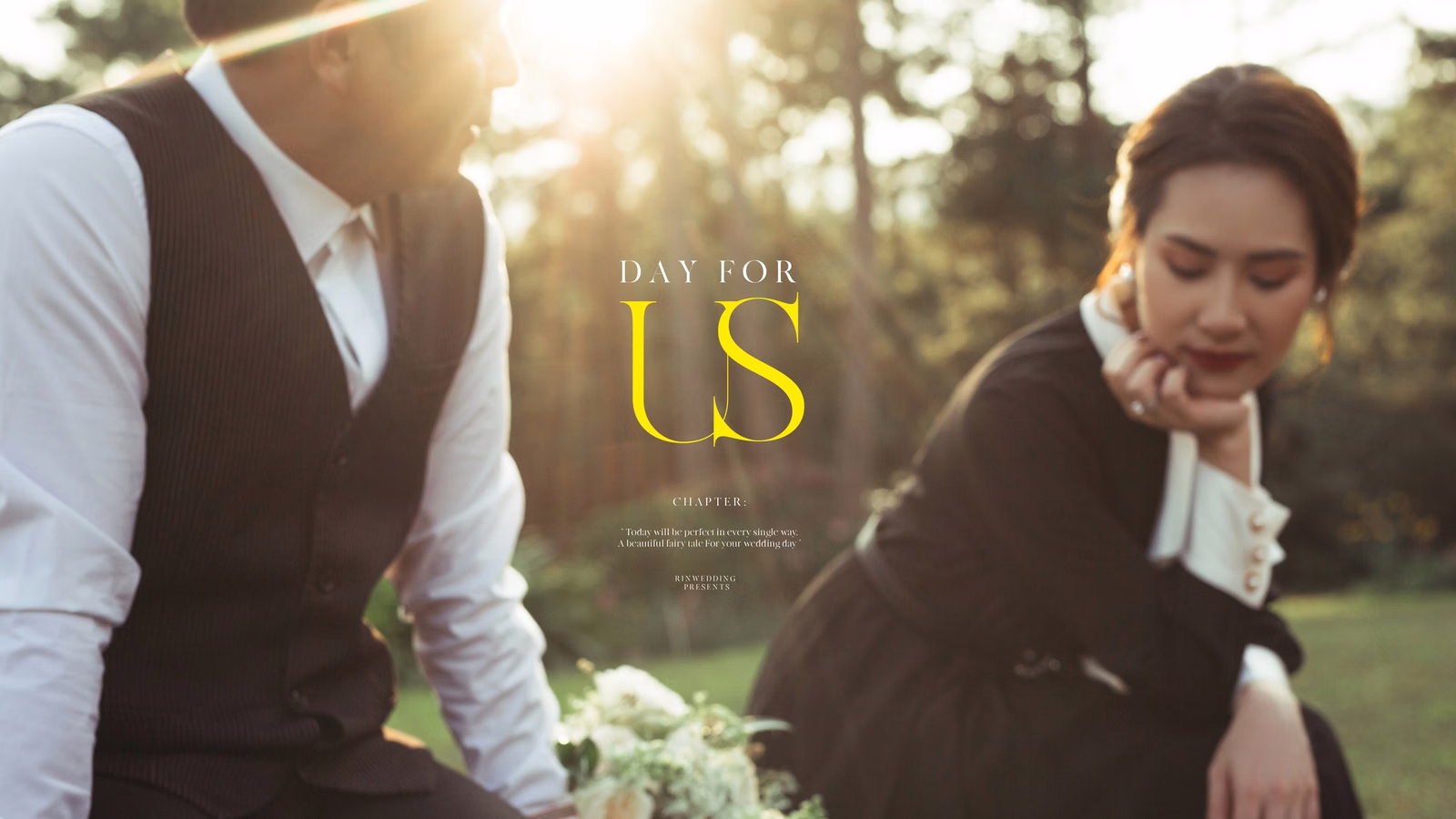 A moment of the bride and groom in sunlight, with decorative lettering.