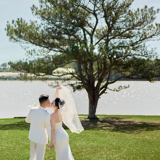 A couple seen from behind beneath a pine tree with a long veil at Cây Thông Cô Đơn, Đà Lạt